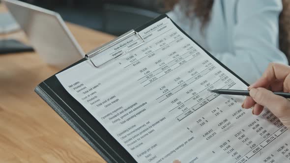 Close Up of Business Documents with Figures