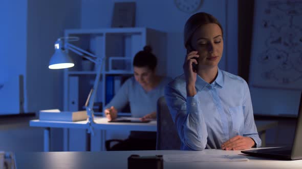 Businesswoman Calling on Smartphone at Dark Office 92