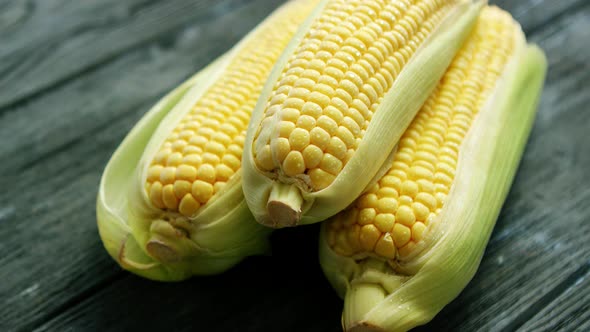 Corn on Cobs on Wooden Table