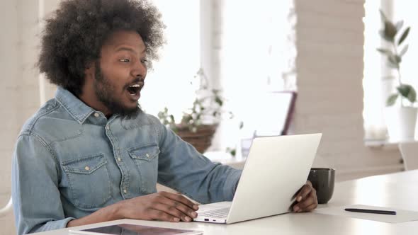 Online Video Chat on Laptop at Work By African Man