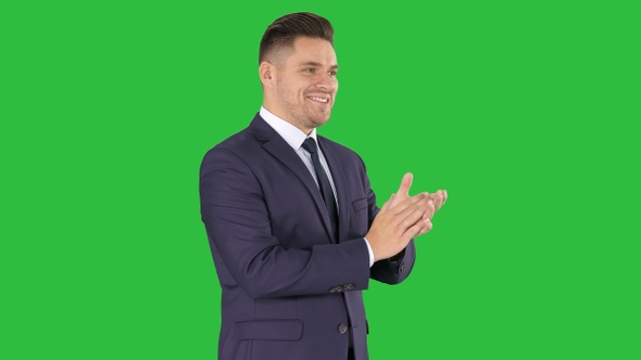 Businesses man applauding on a Green Screen, Chroma Key