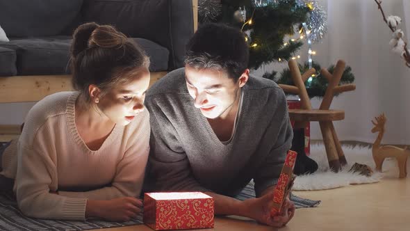 Loving Couple Exchanging Gifts