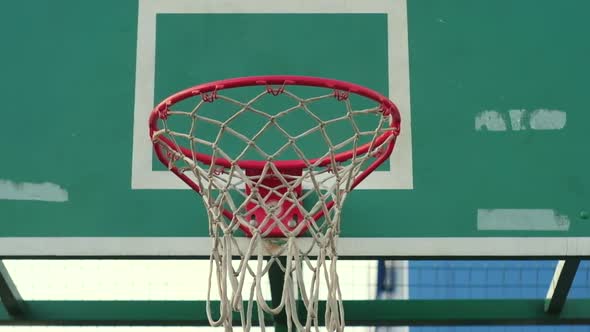 Basketball Ball Flies Into a Hoop Goal