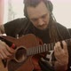 Musician with Dreadlocks Playing Guitar at Home - VideoHive Item for Sale