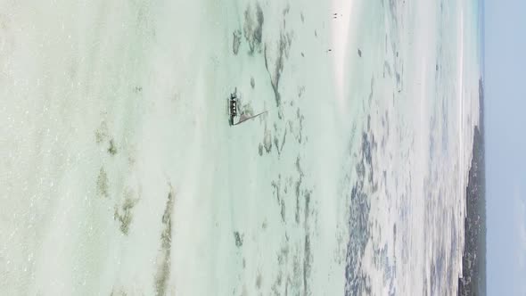 Vertical Video of Low Tide in the Ocean Near the Coast of Zanzibar Tanzania Aerial View