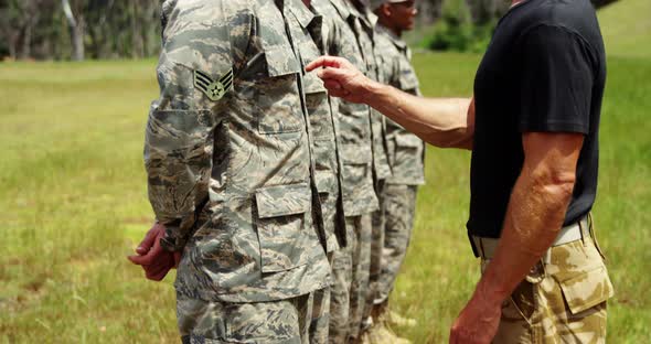Male trainer training military troops 