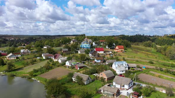 Beautiful Village Landscape on a Hill Near the Lake