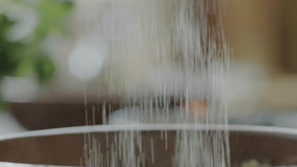 Sifting Flour into Bowl