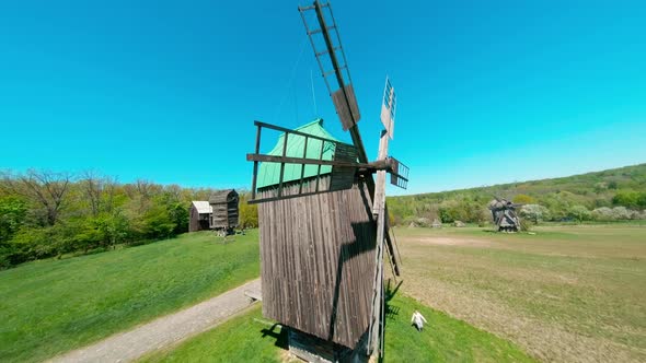 FPV Drone Flies Over the Ukrainian Authentic Village of Pirogovo with Windmills Near Kiev