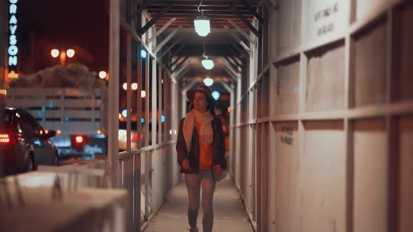 Young girl in a hat in the city