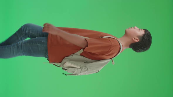 The Side View Of Asian Boy Student Walking To School On Green Screen Chroma Key