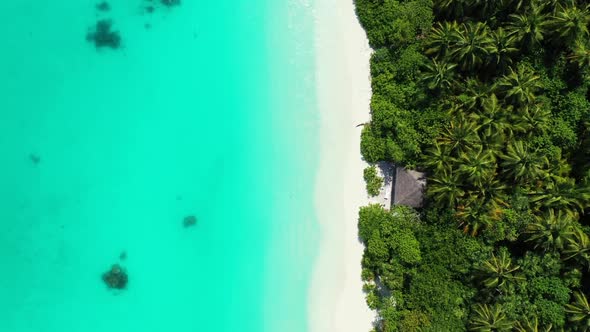 Aerial drone shot nature of luxury shore beach journey by blue ocean and clean sandy background of a