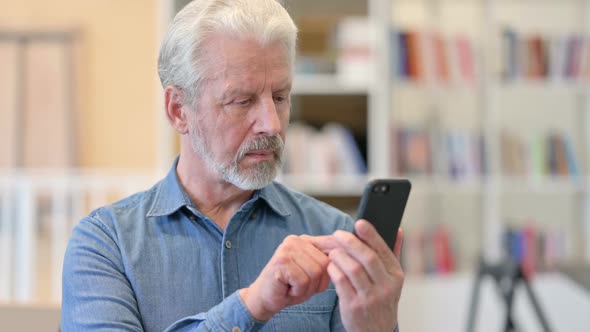 Old Man Using Smartphone