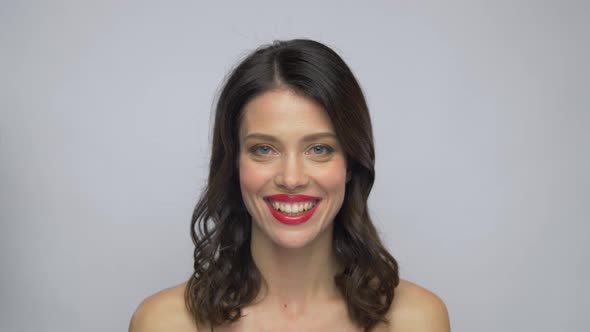 Beautiful Smiling Young Woman with Red Lipstick