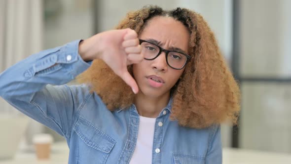 Portrait of Thumbs Down Gesture By Young African Girl