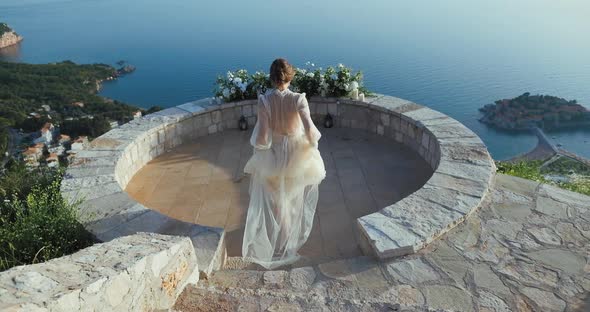 Beautiful bride in a white wedding dress on the background of nature in Montenegro.