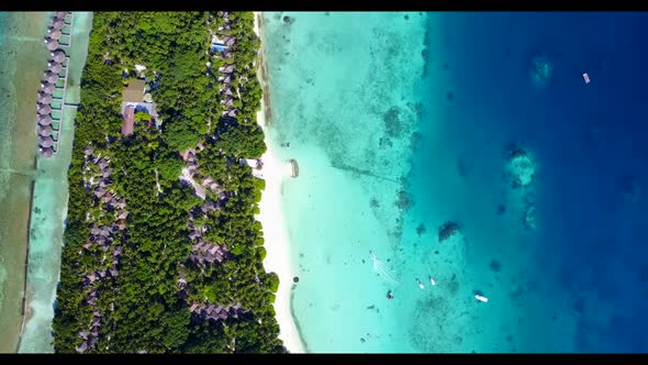 Aerial top view sky of perfect coast beach wildlife by blue water and white sand background of a day