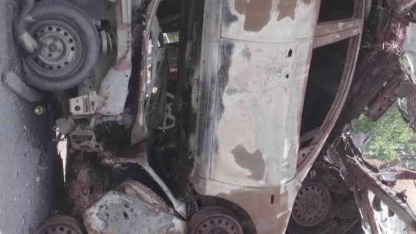 Vertical Video Irpin Ukraine  Burnt and Destroyed Cars