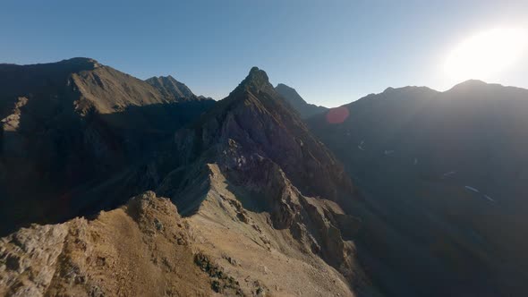 Aerial View Mountain Ridge Structure with Communication Electricity Tower Sun Light Glare