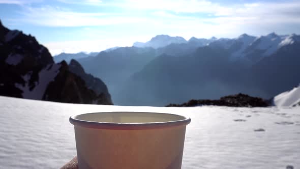 Steam From Hot Tea in a Mug in the Mountains