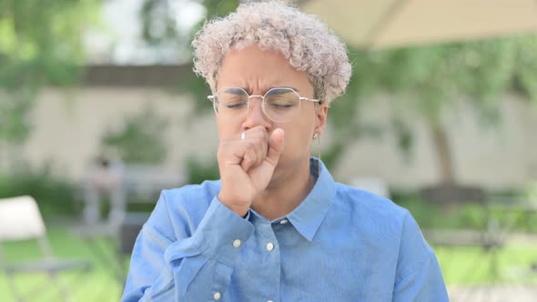 Portrait of Young African Woman Coughing