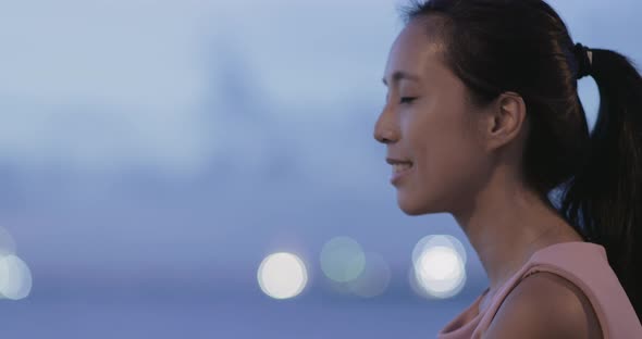 Young asian woman smiling in the evening 