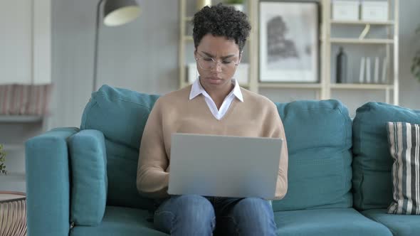 African Girl Get Surprised While Working on Laptop