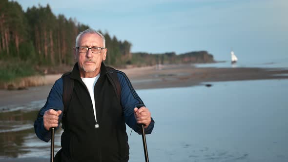 Portrait Aged 70s Grandfather Posing Walking Stick at Sunset Beach Sea Shore Sail Boat