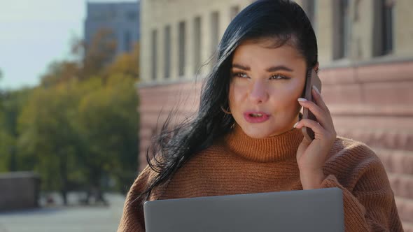 Young Multitasking Girl Talking on Telephone Smiling Answering Friendly Call Orders Internet Service