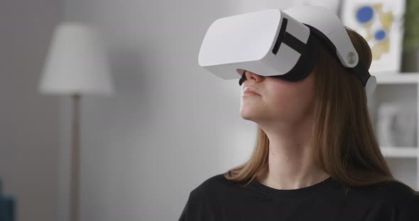 Female User Is Testing New Model of Headmounted Display for Virtual Reality Medium Portrait of Woman