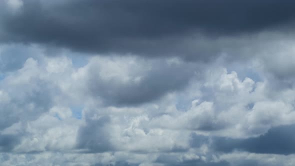 Dramatic sky with storm cloud on a cloudy day time lapse. alt