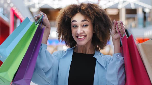 Closeup Contented Happy African American Woman Girl Holding Bright Shopping Bags Purchases Packages
