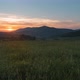 Colorful Sunset over Grass Field in Bieszczady Mountains, Poland - VideoHive Item for Sale
