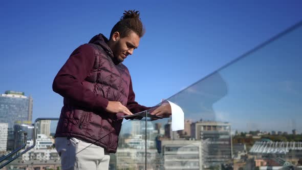 Busy Troubled African American Male Analyst Analyzing Paperwork Sighing Looking Away