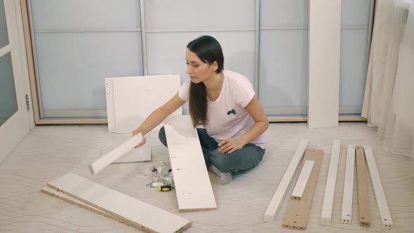 Woman Try To Assemble Furniture