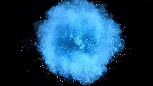 Super Slow Motion Shot of Rotating Blue Powder Expolosion Isolated on Black Background at 1000Fps