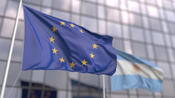 Flags of the EU and Argentina in Front of a Modern Skyscraper