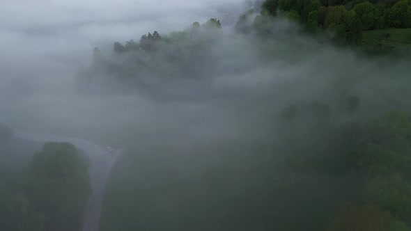 Flying over the foggy countryside / Videohive