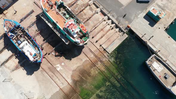 Docked Boats and Sunken Fishing Vessels on a Harbour