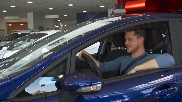 Male Customer Shows His Thumb Up From Inside the Car