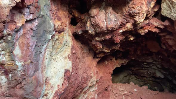 Dolly parallax shot from the cave of an ancient red ochre mining site