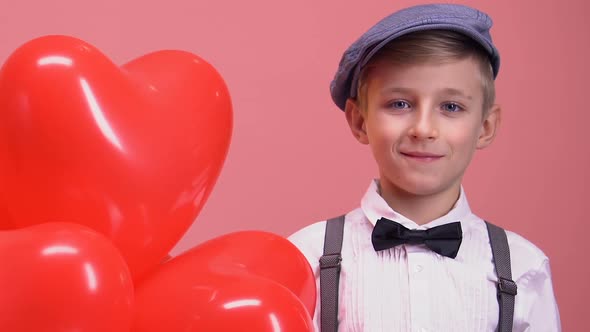 Shy Little Boy With Heart-Shaped Balloons Smiling to Camera, Valentines Day Gift