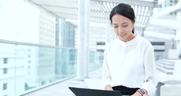 Business woman use of laptop computer at outdoor