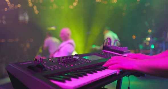 Close Up View of Musician Hand Playing Synthesizer Piano on Live Concert at Stage