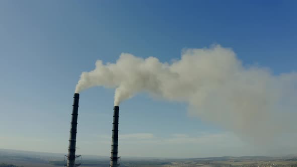 Aerial Drone View of Emission to Atmosphere From Industrial Pipes