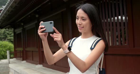 Travel woman use of mobile phone to take selfie 