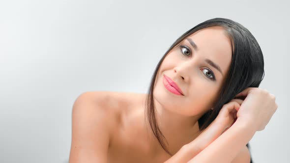 Medium Closeup Portrait of Sexy Smiling Naked Brunette Female Posing Looking at Camera