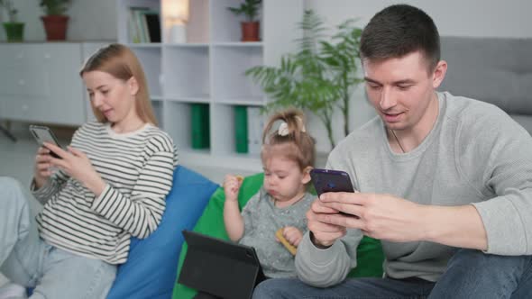 Parenthood Young Married Couple with Parents with Their Daughter Uses Modern Technology and Text