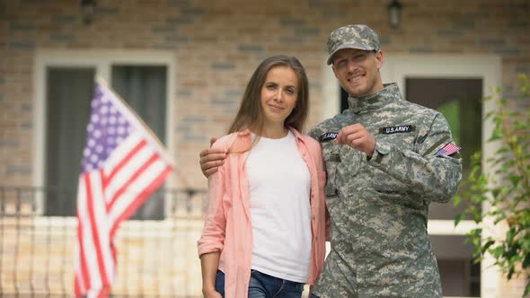 Soldier and Wife Showing Keys From New House, Government Social Insurance