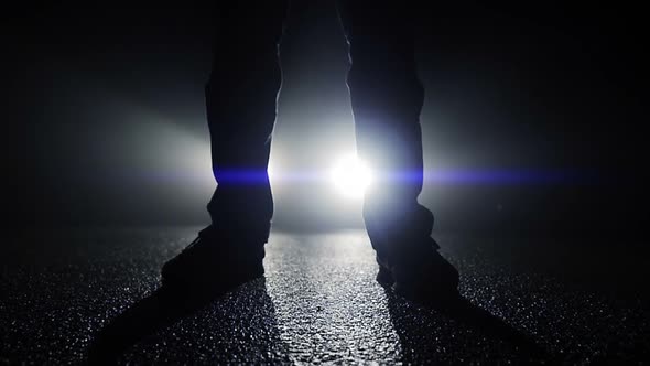 Silhouette of Man Person Standing on Street in Dark Night